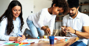 family creating art together in their home