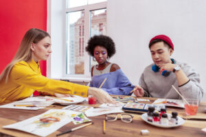 3 young adults at a group art with Creative Ventures Gallery